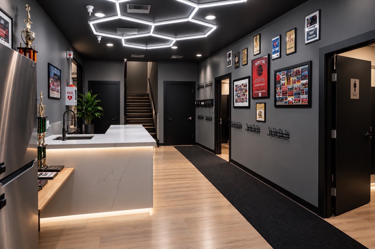 Clean modern facility entry with trophy display and guest amenities